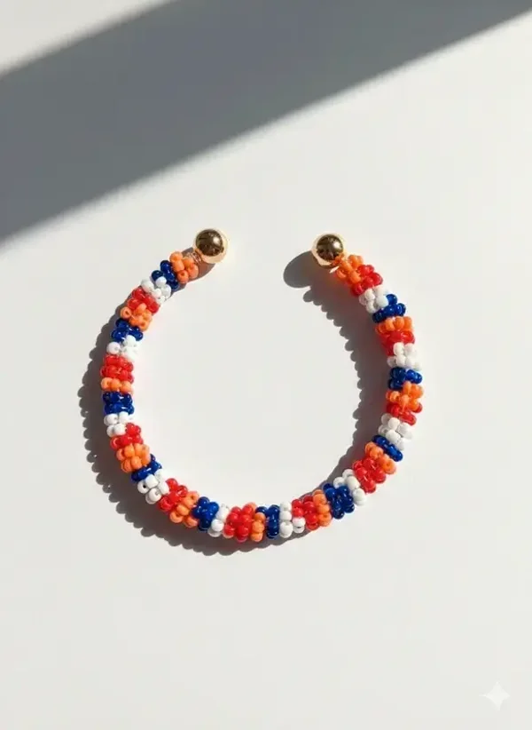 Kleurrijke kralenarmband cuff met gouden details