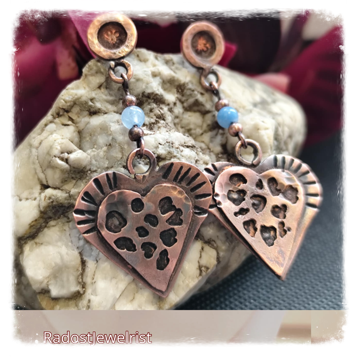 Art Cooper earrings heard with aquamarine