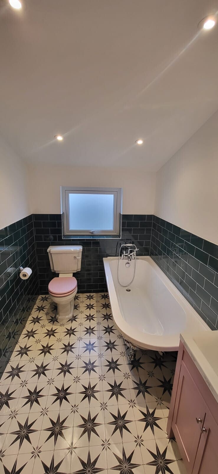 Bathroom renovation in Ware, dark green metro tiles half tiled walls. 