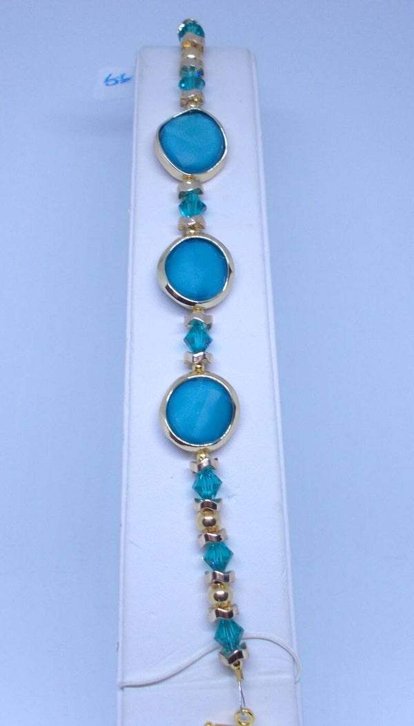 Teal and gold disc bracelet with crystals.
