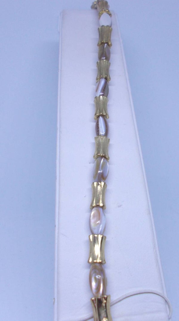 Mother of Pearl Shell and gold bracelet.