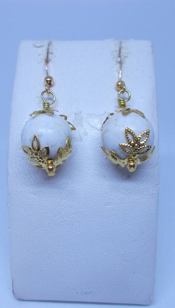 Magnesite with gold tone filagree accent earrings.