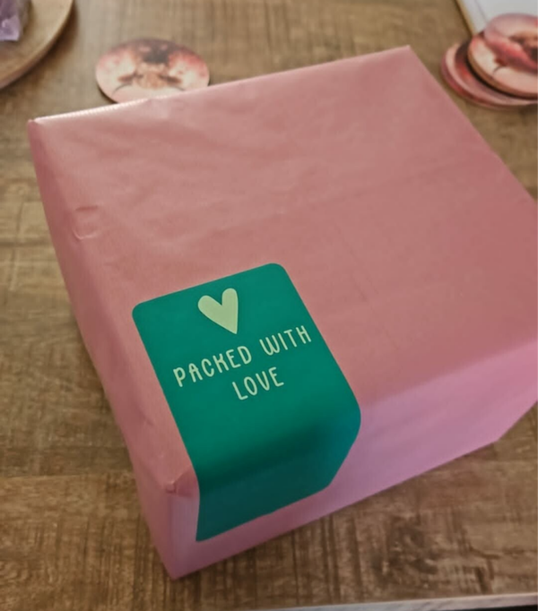 Laat je kadootje inpakken ( roze inpakpapier)