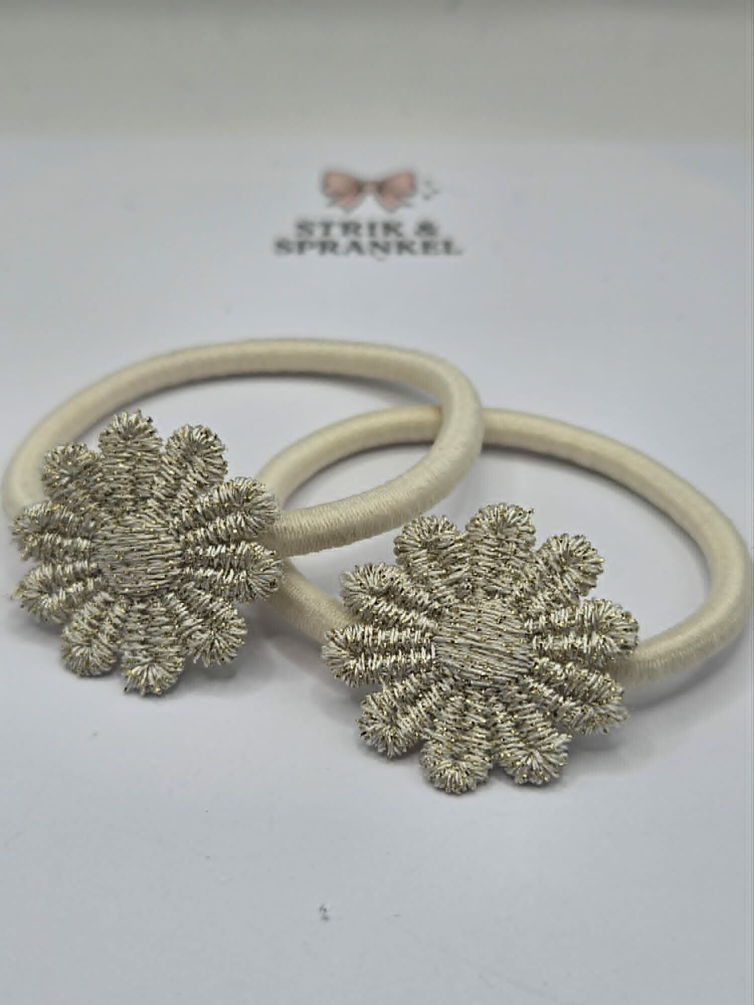 Haarelastiek zilver/goud bloem