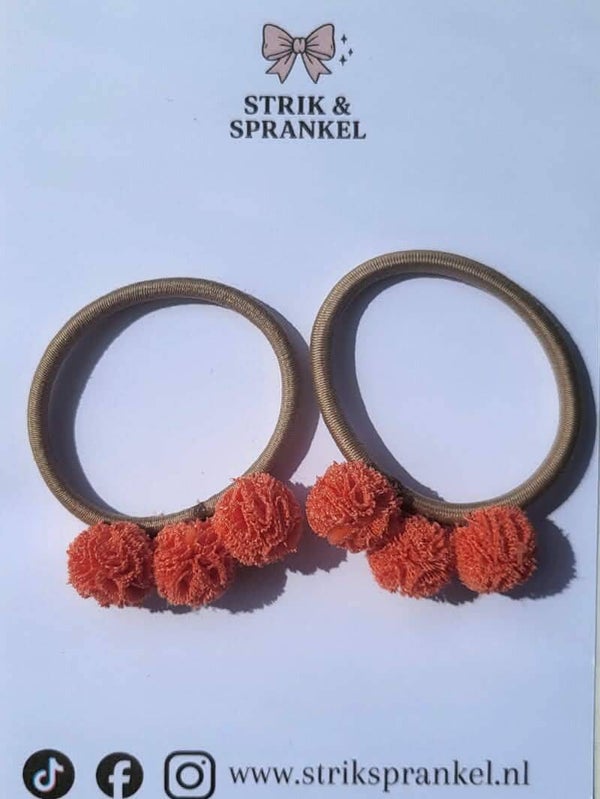 Haarelastiek ponponnetjes oranje