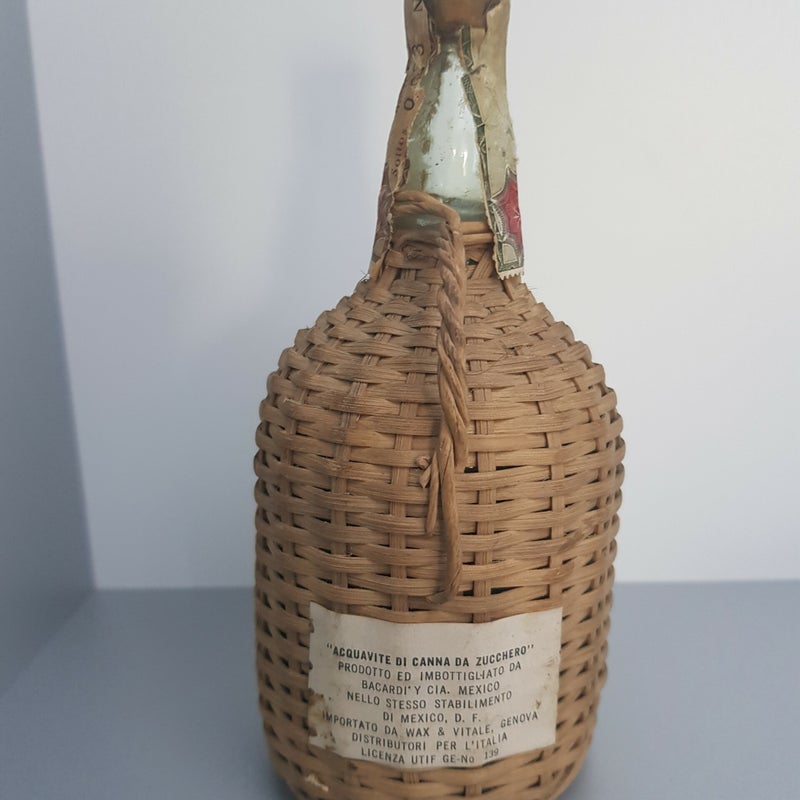 Bacardi Carta de Oro. 250 ml. In wicker basket. Produced in the early 60's
