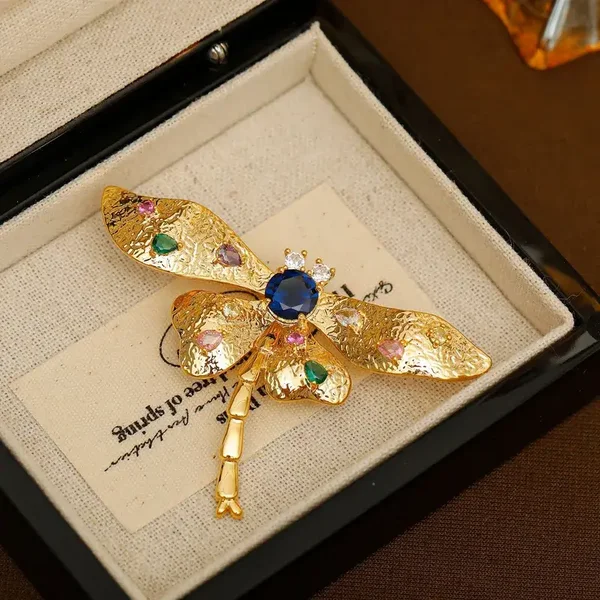 Broche Libellule Stylisée Métal Doré Zircon