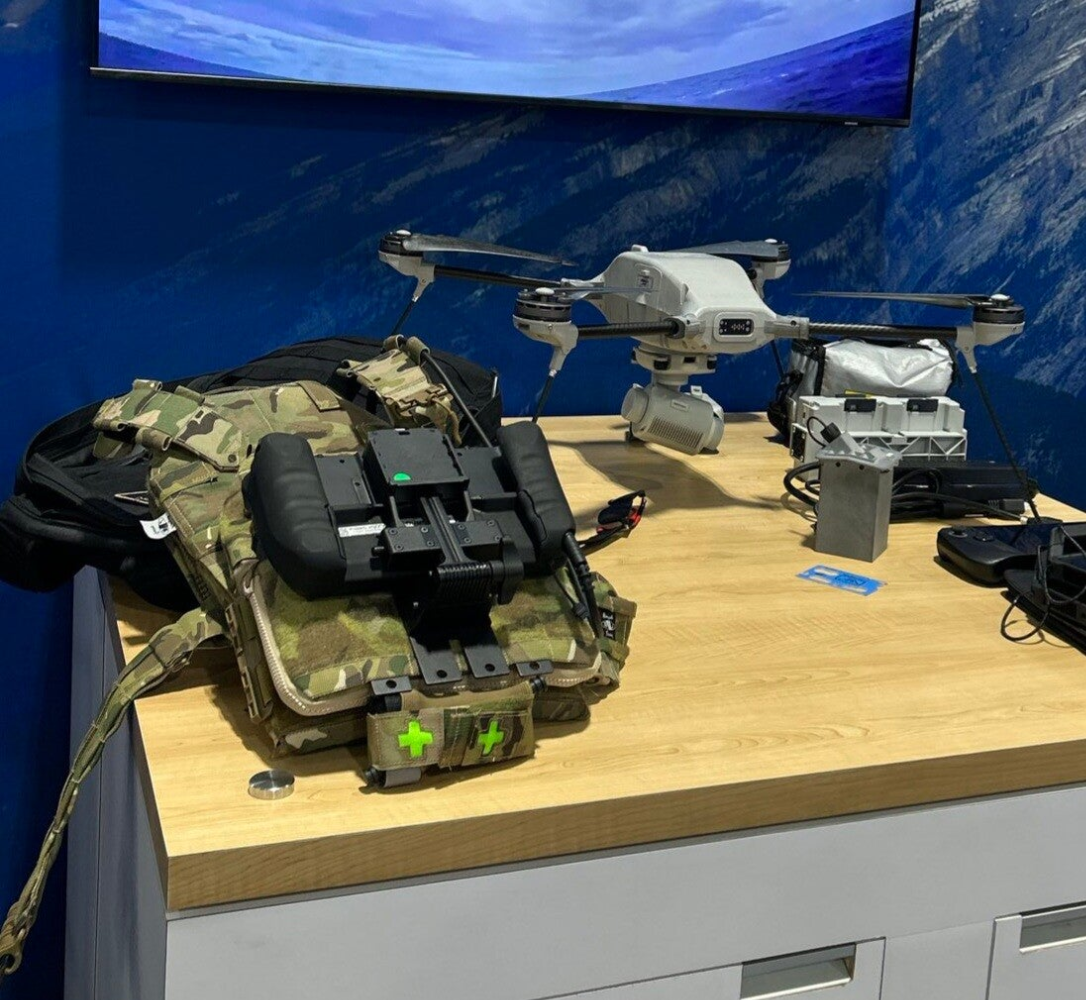JTAC plate carrier by renegade sewing in multicam shown next to UAV platforms at Lockheed Martin CANSEC display.