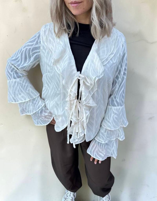 Crème blouse met ruches en strikdetail