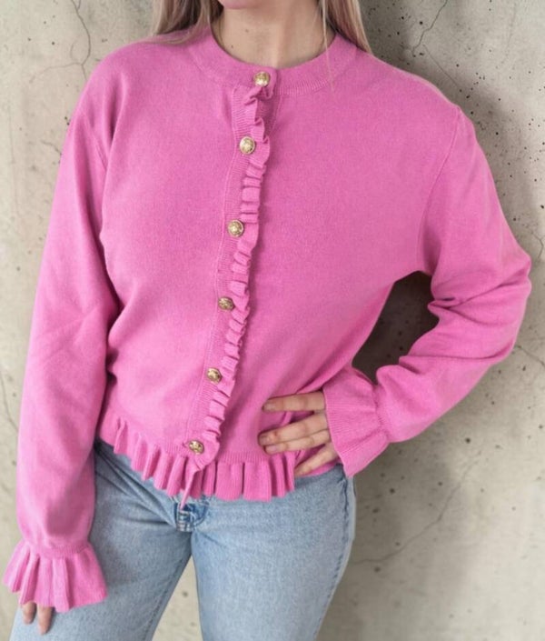 Roze vest met ruches en gouden knopen