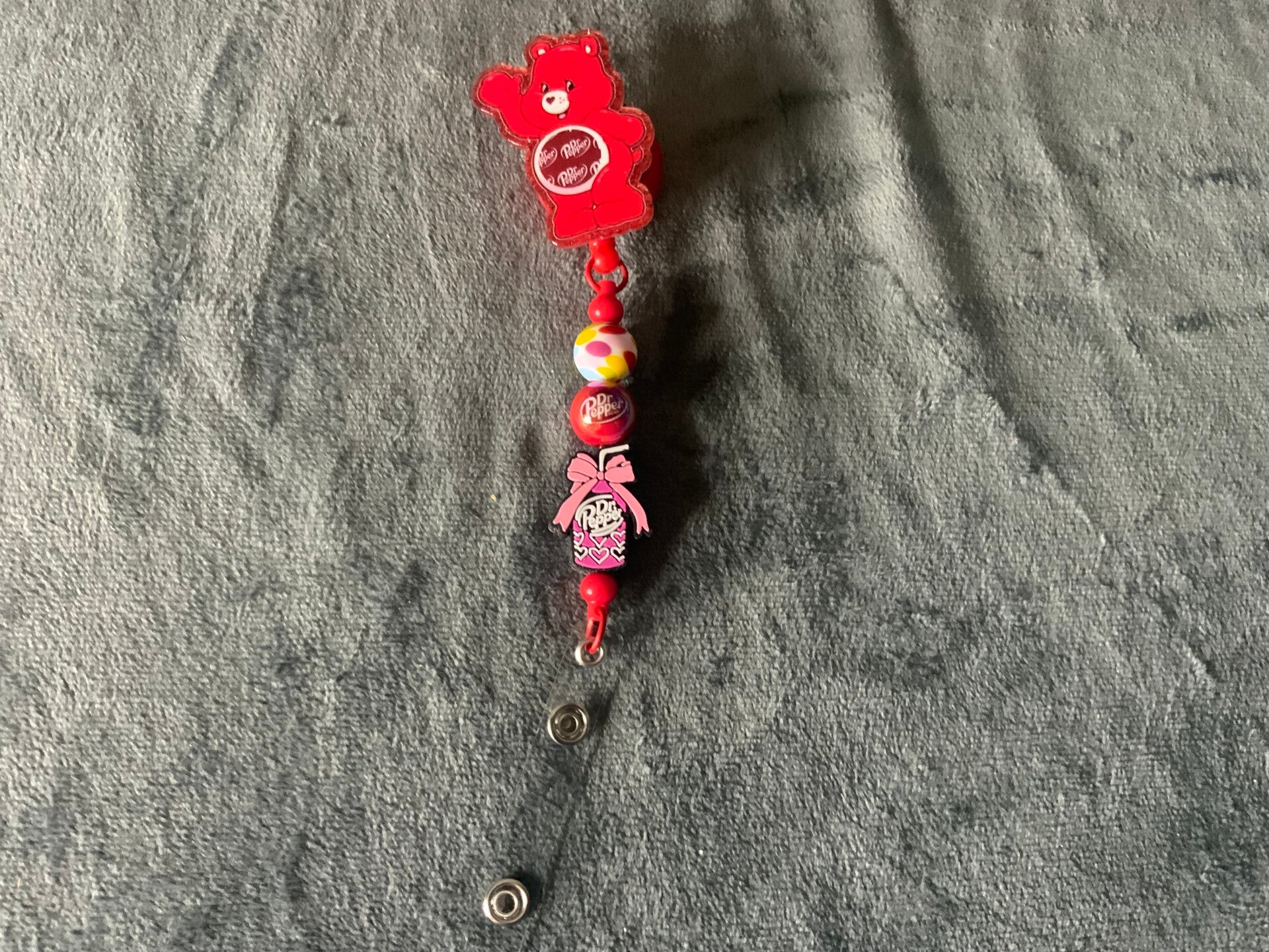 Dr. Pepper Care Bear badge reel