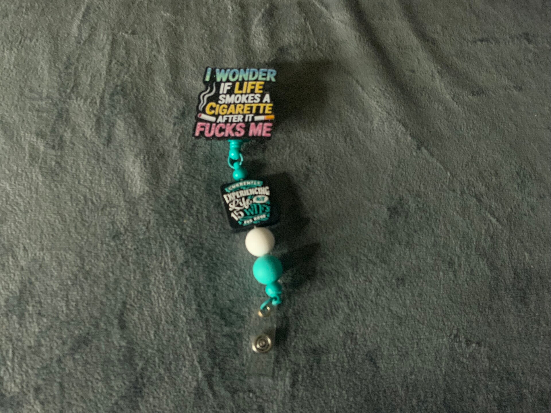 Cigarette beaded badge reel