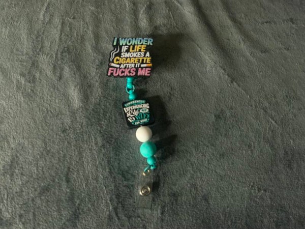 Cigarette beaded badge reel