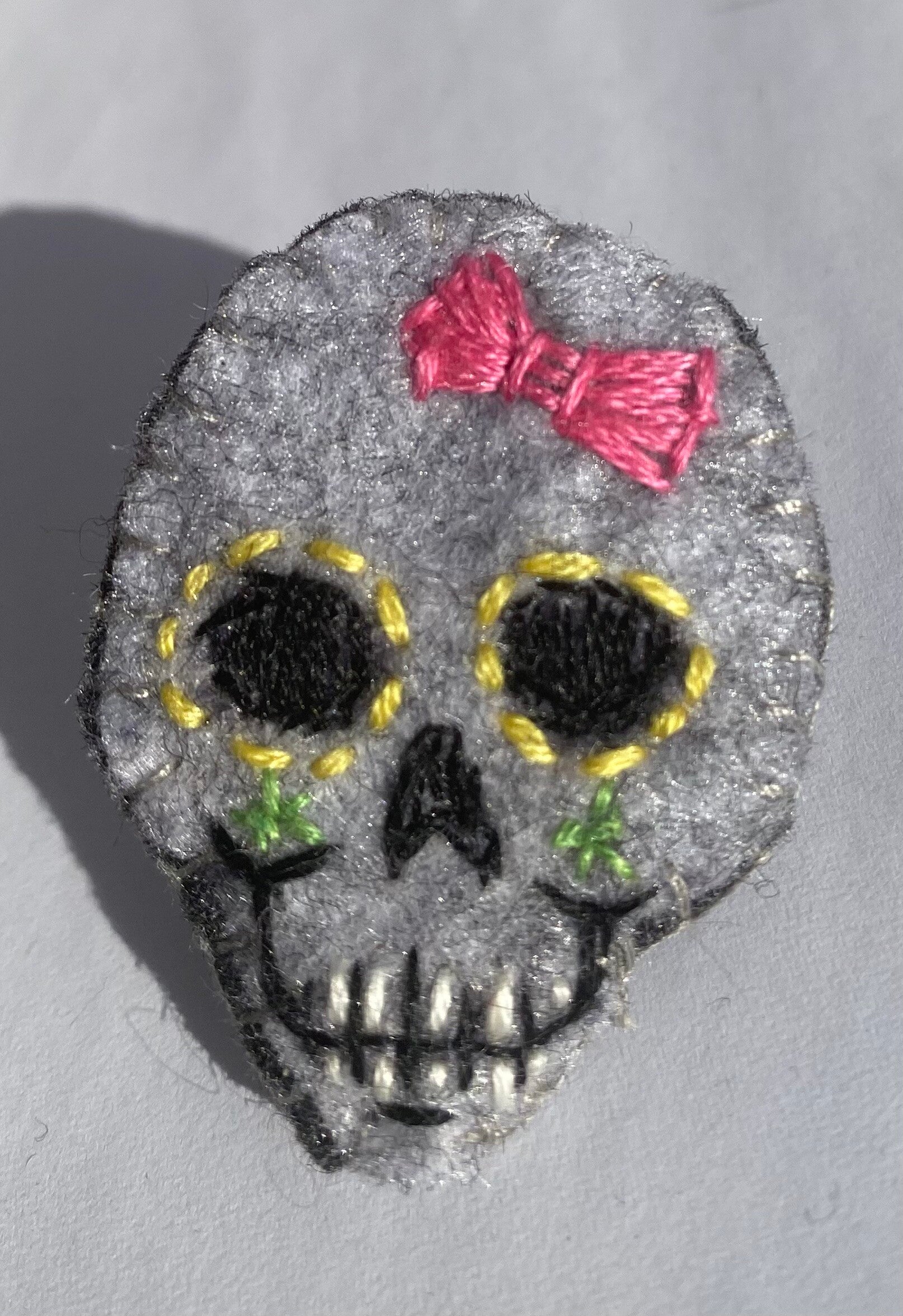 Skull brooch