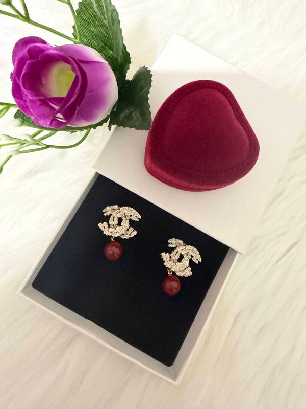 Chanel with red pearls