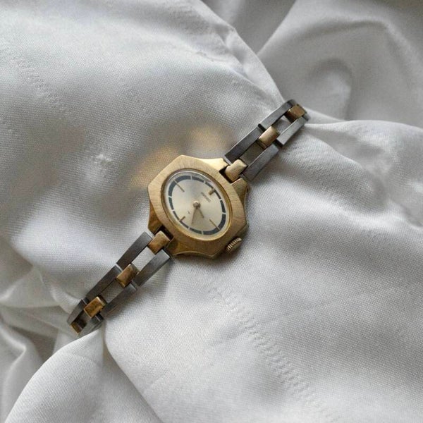 Seiko 7" nonticking two toned watch