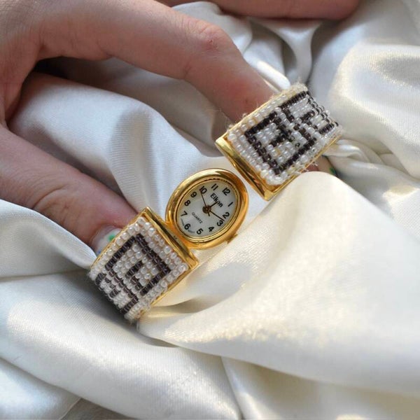 Eikon 6.5” Ticking beaded peekaboo gold watch