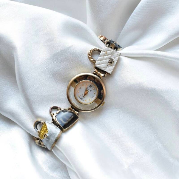 Jennie B 7.25” ticking gold purse watch