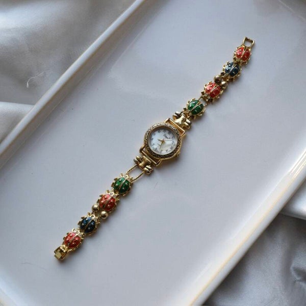 Vivani 7.25” ticking gold watch