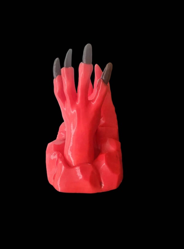 The Devil's hand phone stand