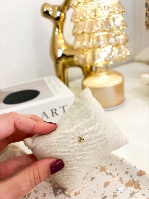 Green gold star piercing