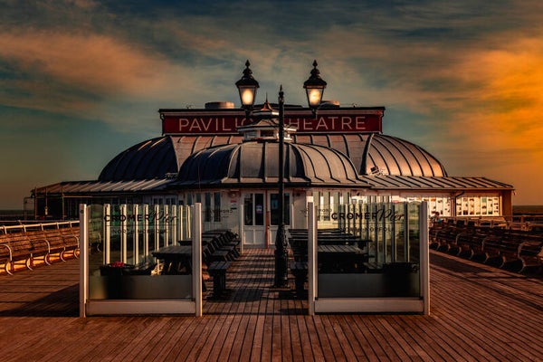 Cromer pier with orange sky.