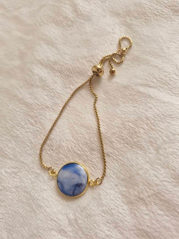 Armband goudkleurig blauw