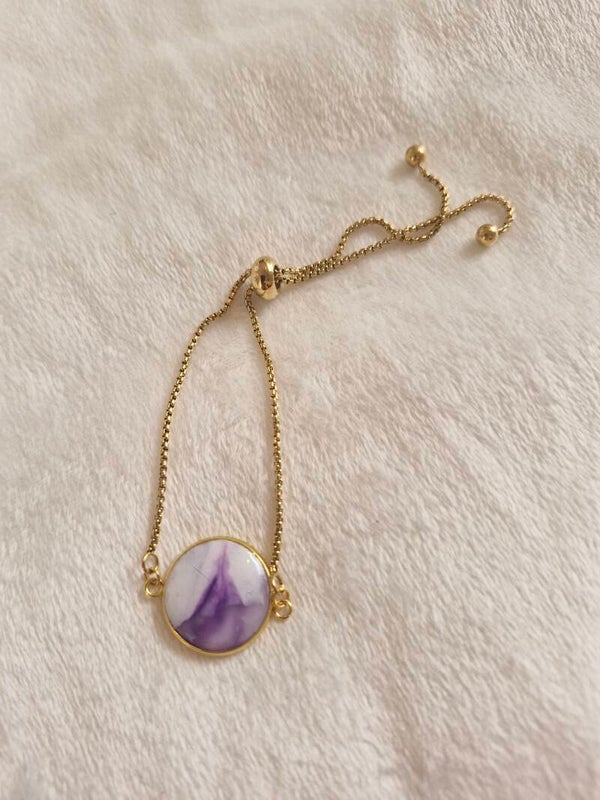 Armband goudkleurig paars