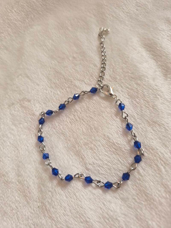 Armband zilverkleurig kraal schakel blauw