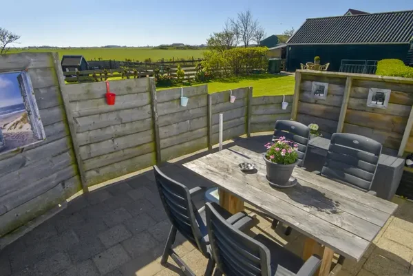 Vakantiehuisje "Duinviooltje" met omheinde tuin 2 gasten nabij De Cocksdorp