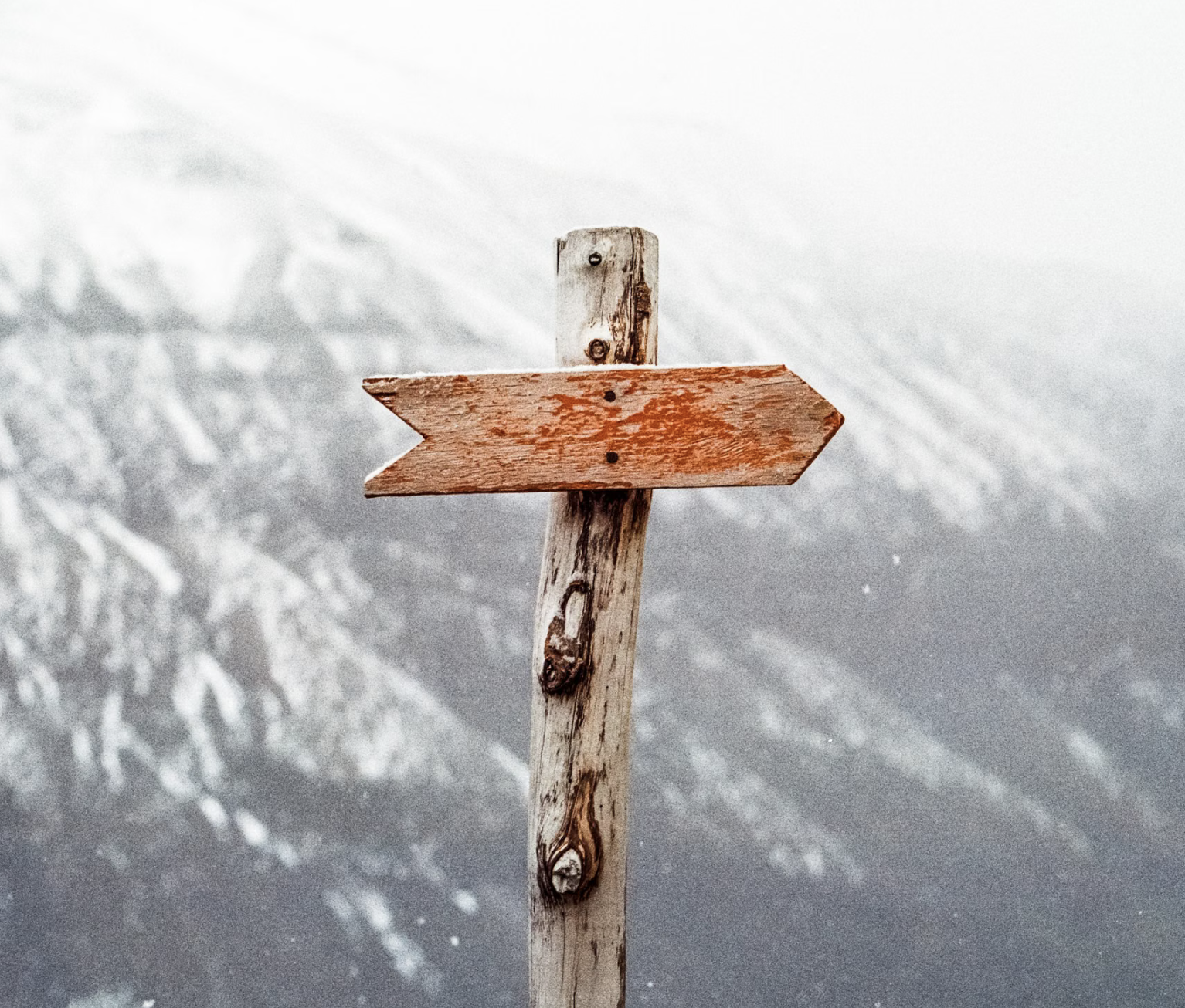A cross pointing to a direction