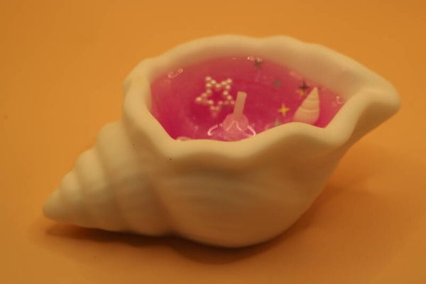 Schelp geurkaars roze.
