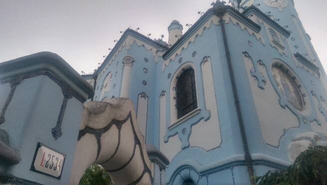 exterior of a blue and white church