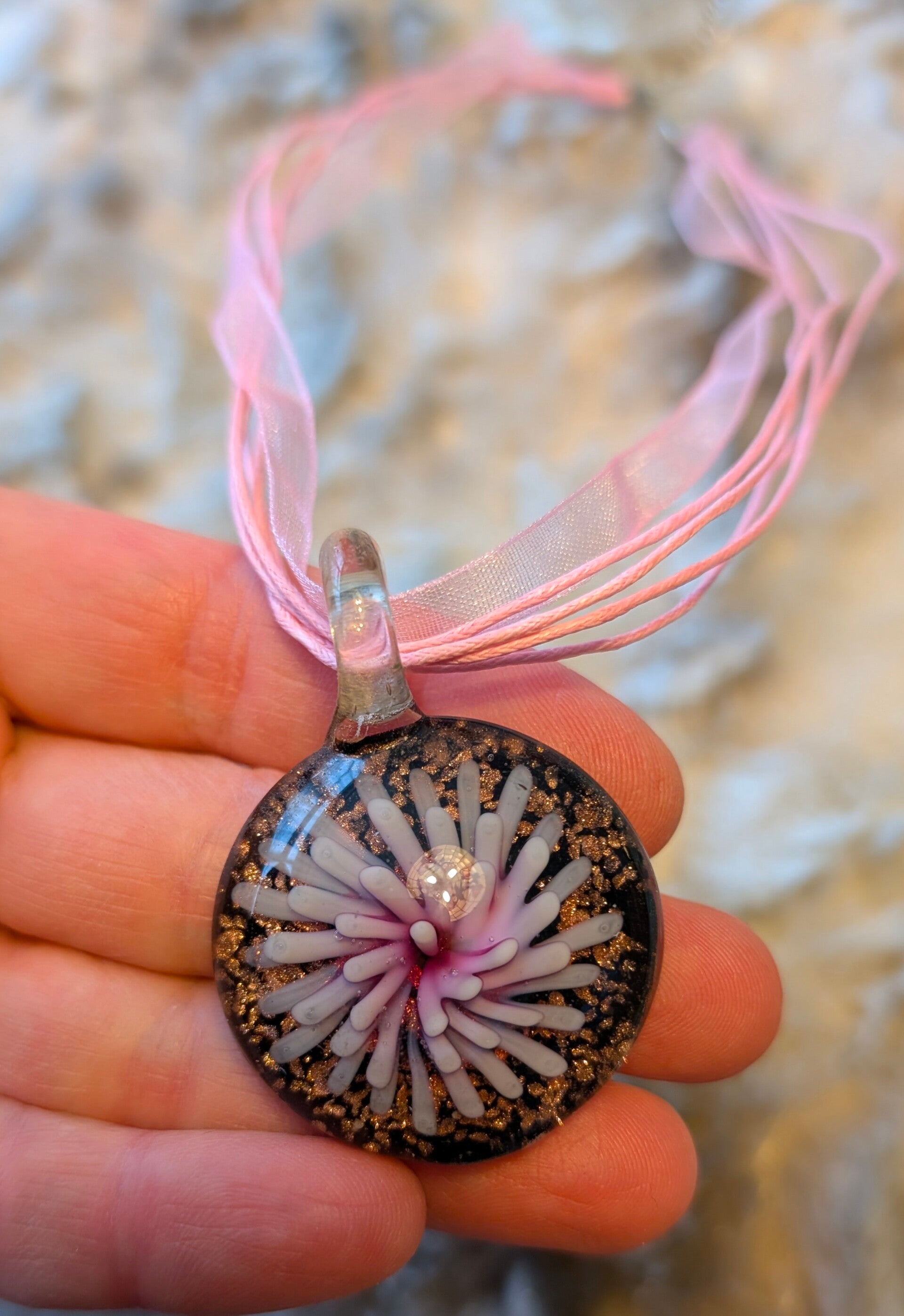 Roze bloesem in glas