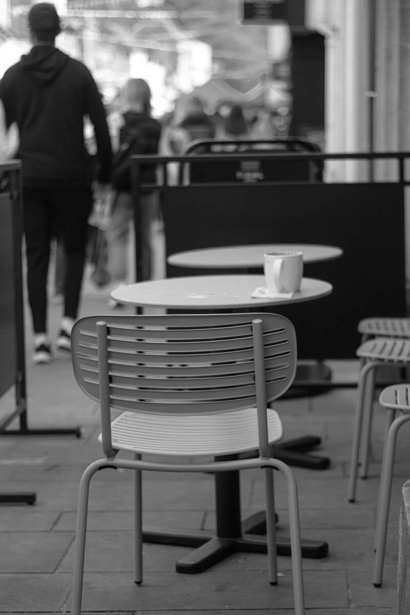 An empty chair at a coffee shop