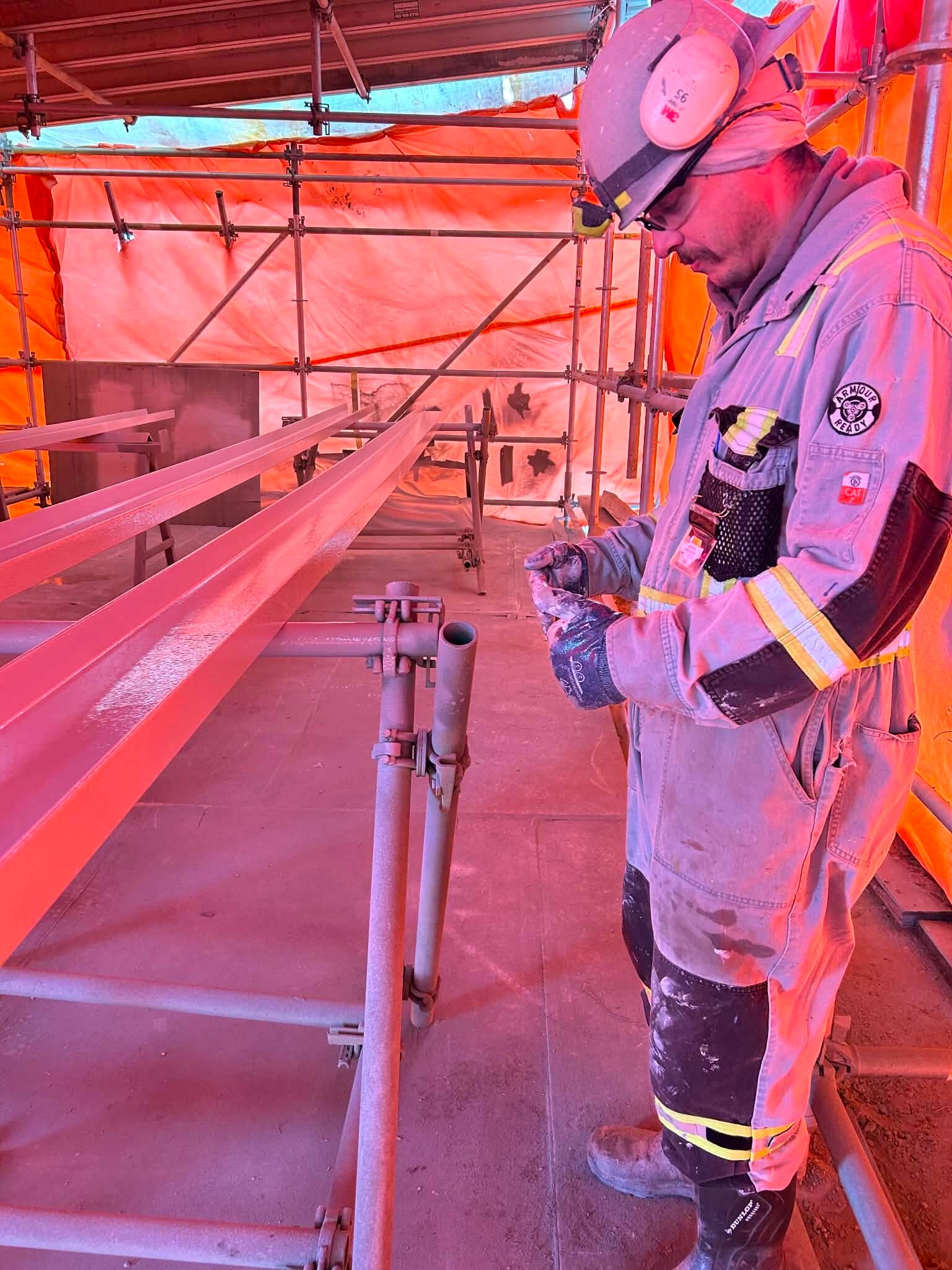Why Safety Culture Matters | An image of a couple workers discussing a document