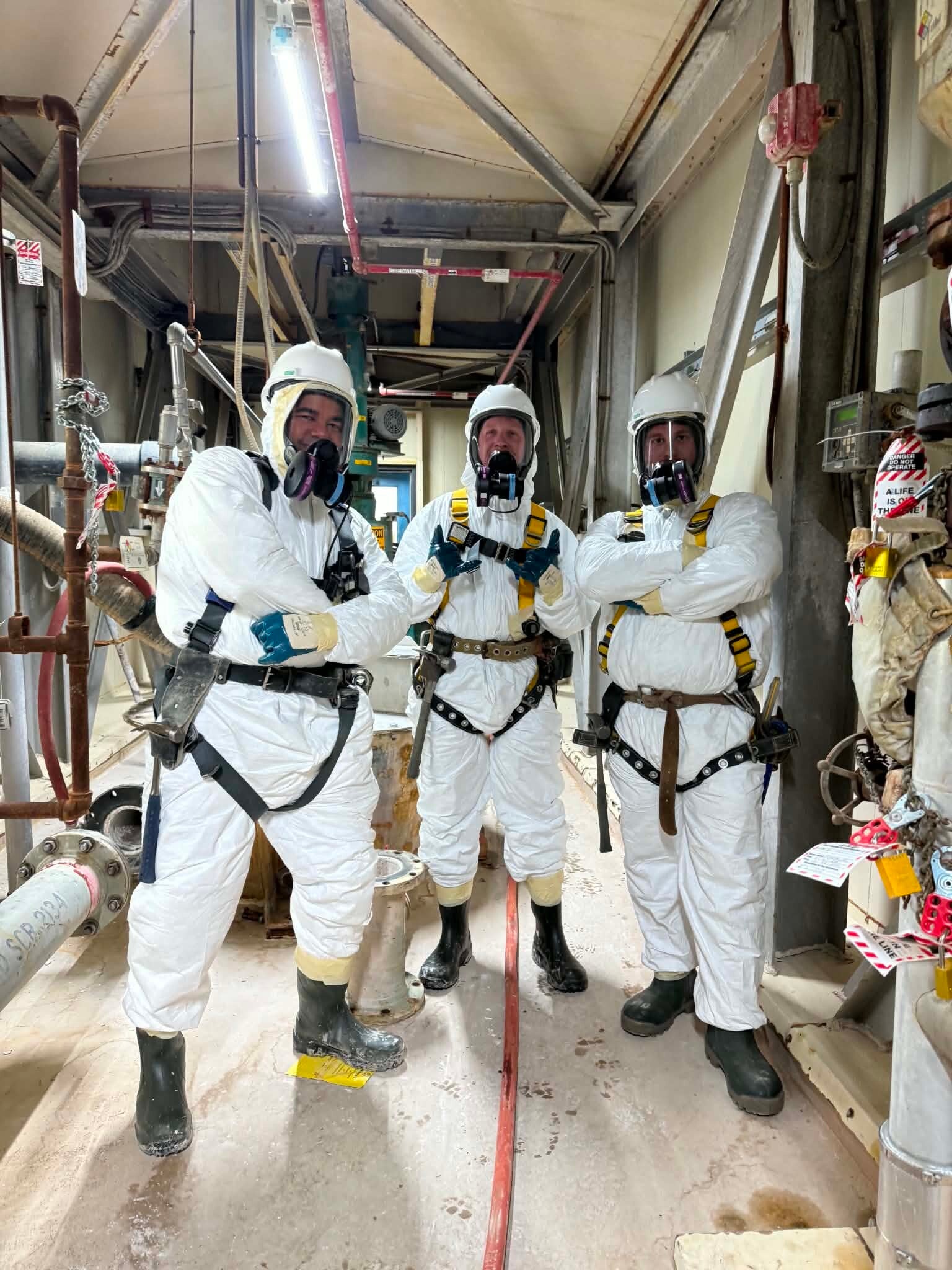 Professional JHA Writing Services | Image of 3 workers in HAZMAT suits
