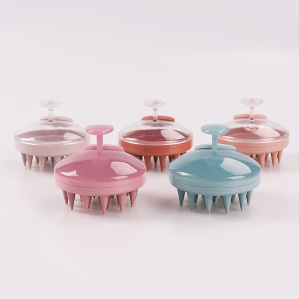 Brosse massante pour cuir chevelu avec applicateur d'huile.