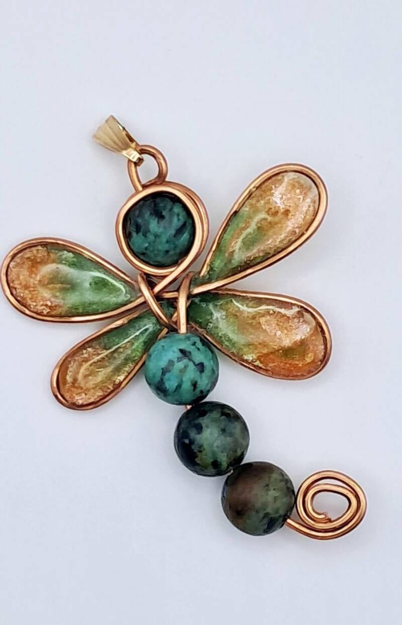Handcrafted Single-Wire Copper Wrapped Dragonfly Pendant with  Resin Wings and semi precious turquoise stones Comes with faux leather necklace. Hypoallergenic.  Measuring 4cm x 5cm  Price €40