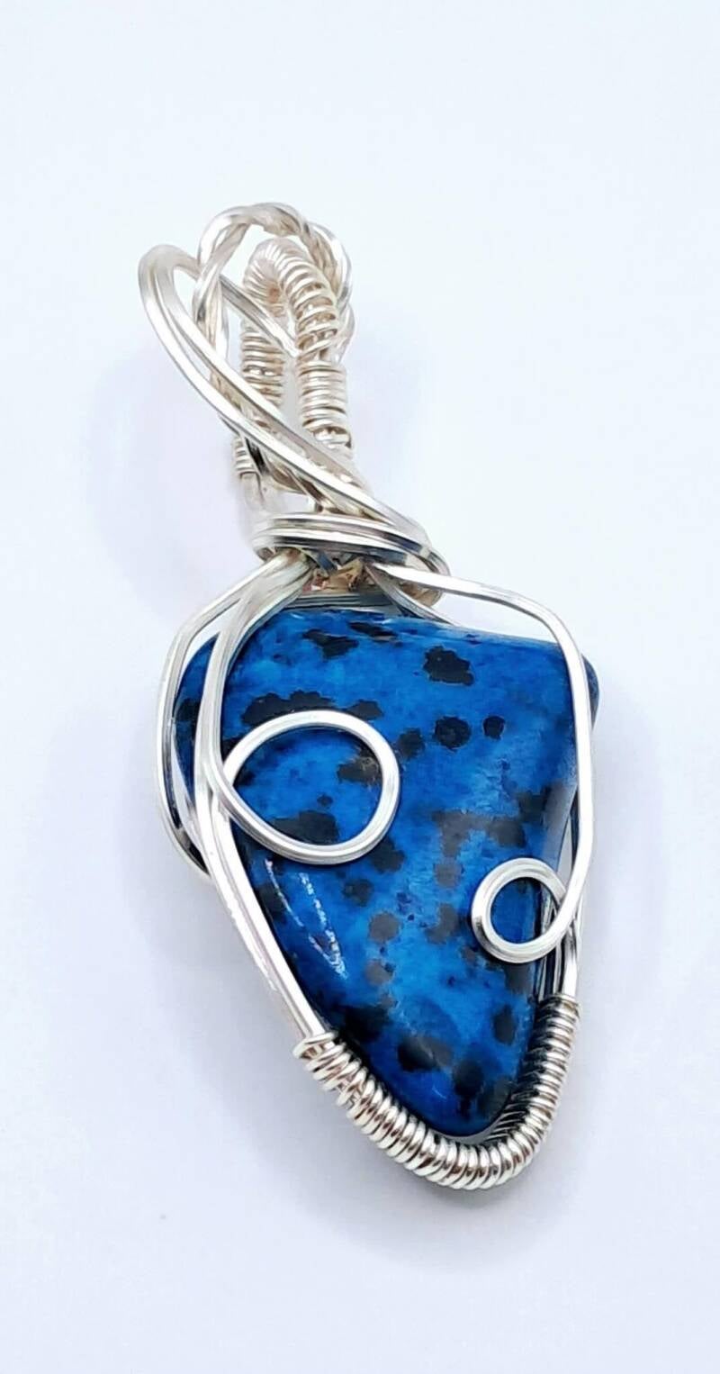 Single silver plated Wire-wrapped gemstone pendant showcasing a vibrant Dalmatian Ja sper, Measuring  2.5 x 6cm.  Price 40€