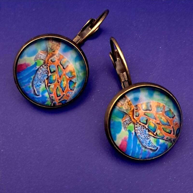 2cm dragonfly earrings featuring vibrant silk art under glass cabochons—available in hypoallergenic silver or antique bronze for 20€