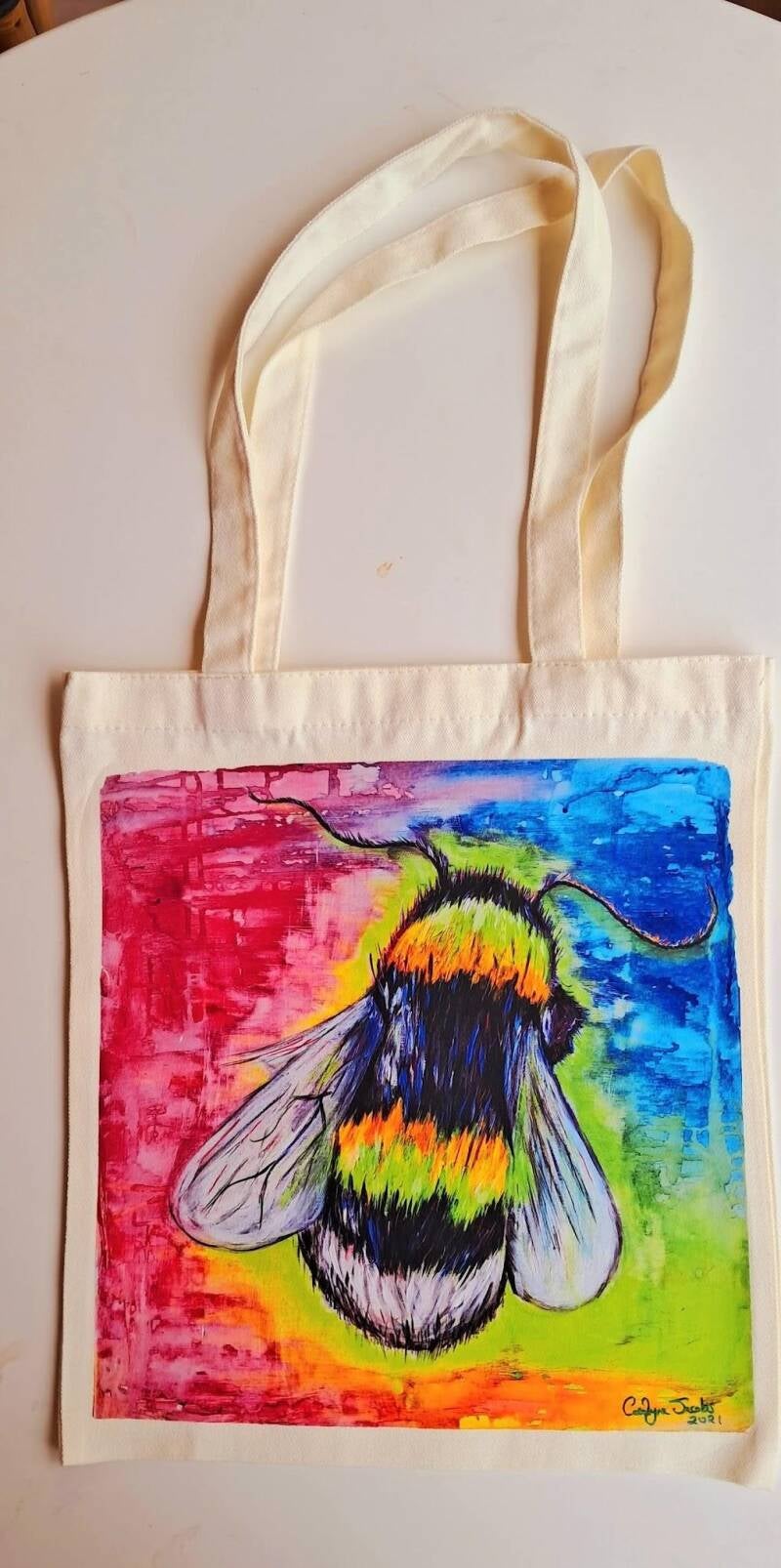 Take my original artwork out of the gallery and into your daily routine. This canvas tote bag features a high-definition reproduction of my vibrant painting  Price at  15€