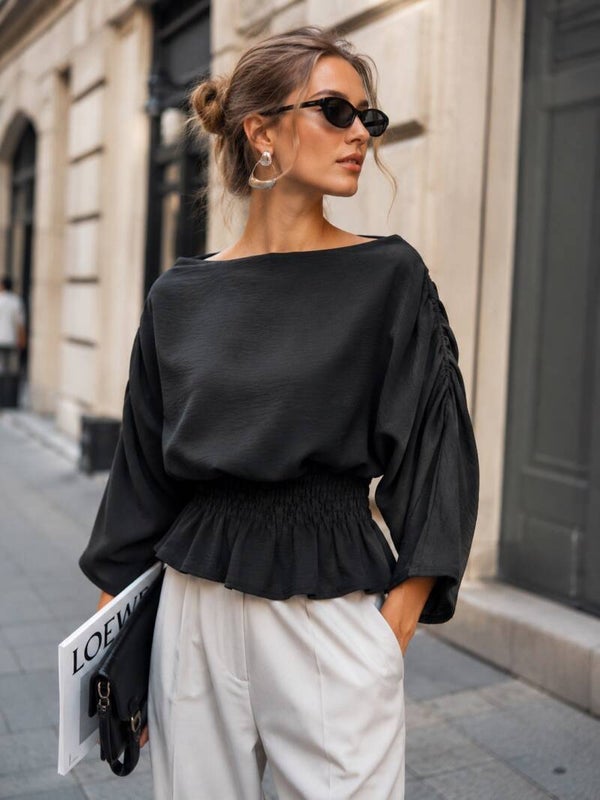 Zwarte blouse met smocktaille