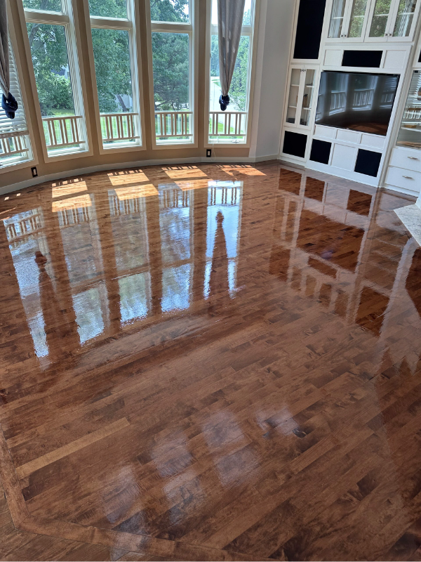 Buffing and coating existing 2 ΒΌ-inch maple hardwood floors by Majestic Hardwood Floors in Bloomington, Minnesota.