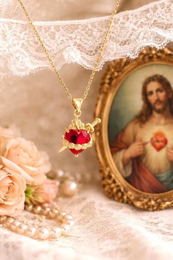 Sacred heart necklace with sword