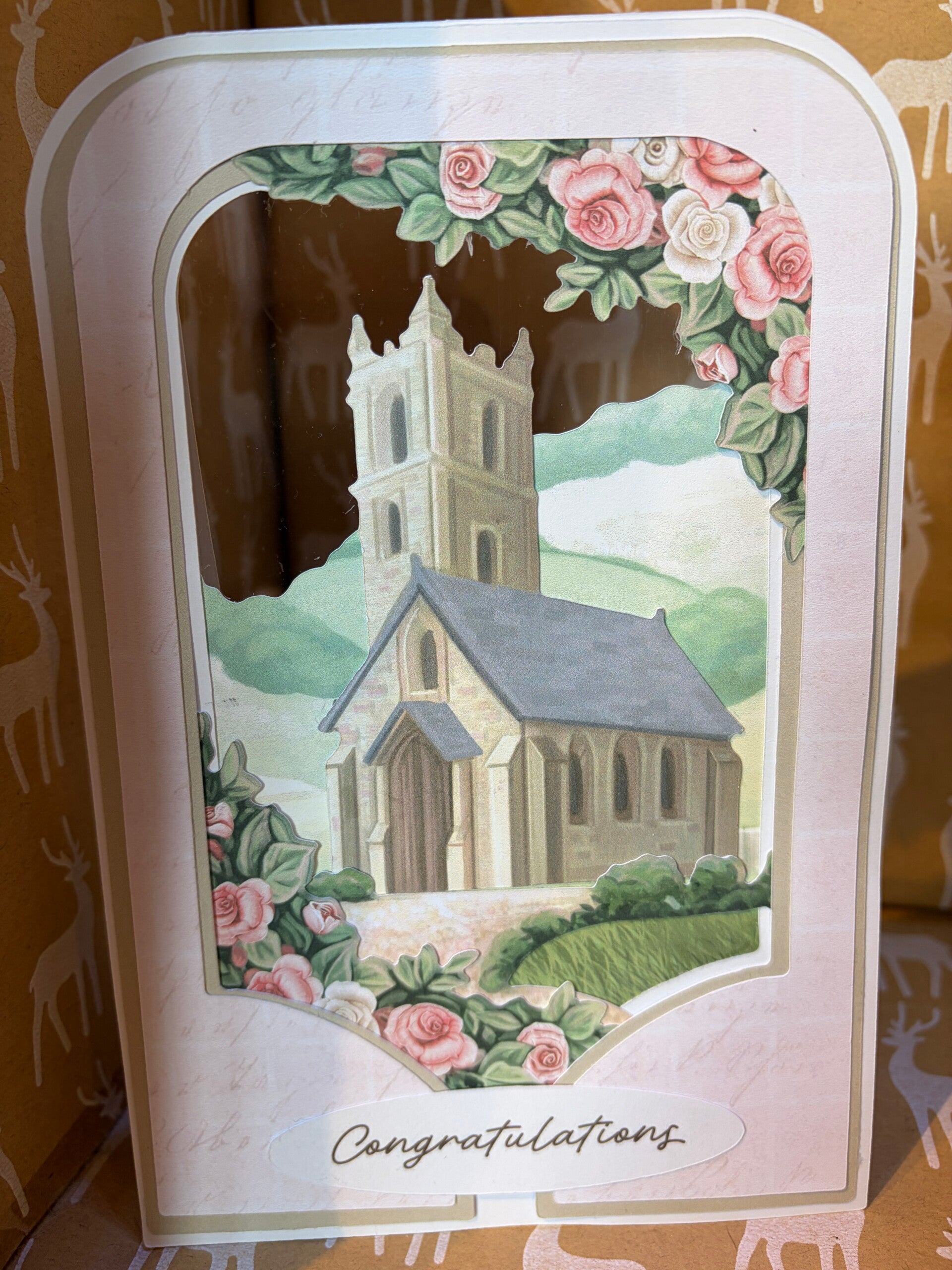 A amazing  card with congratulations on it and a church suitable for all occasions