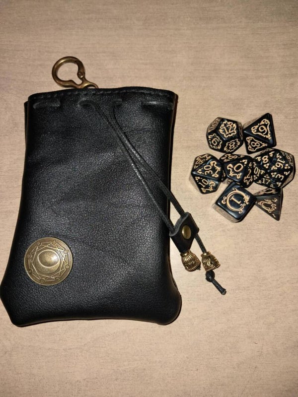 Black leather bag with dragon d&d dice