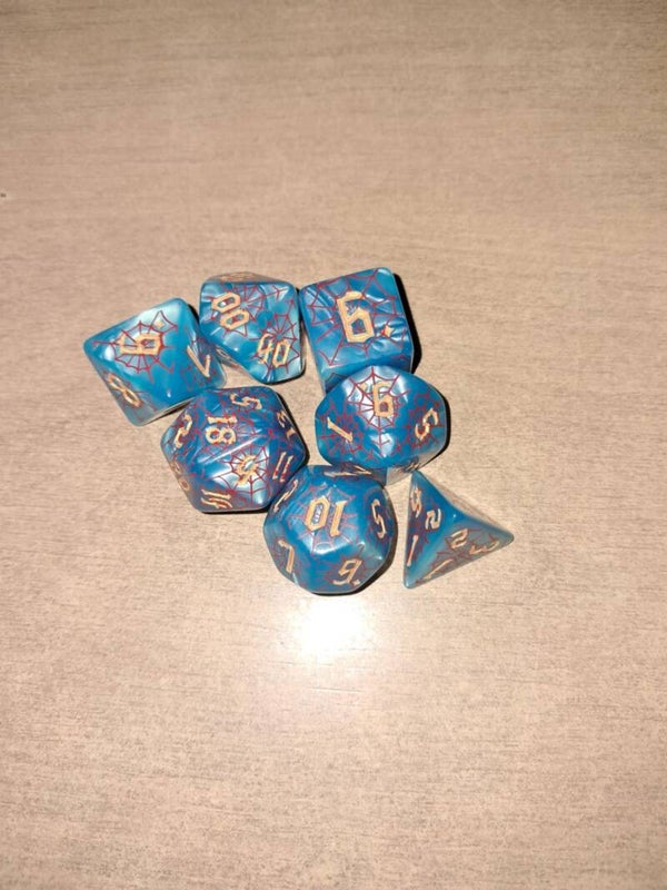 Blue d&d dice with a red web