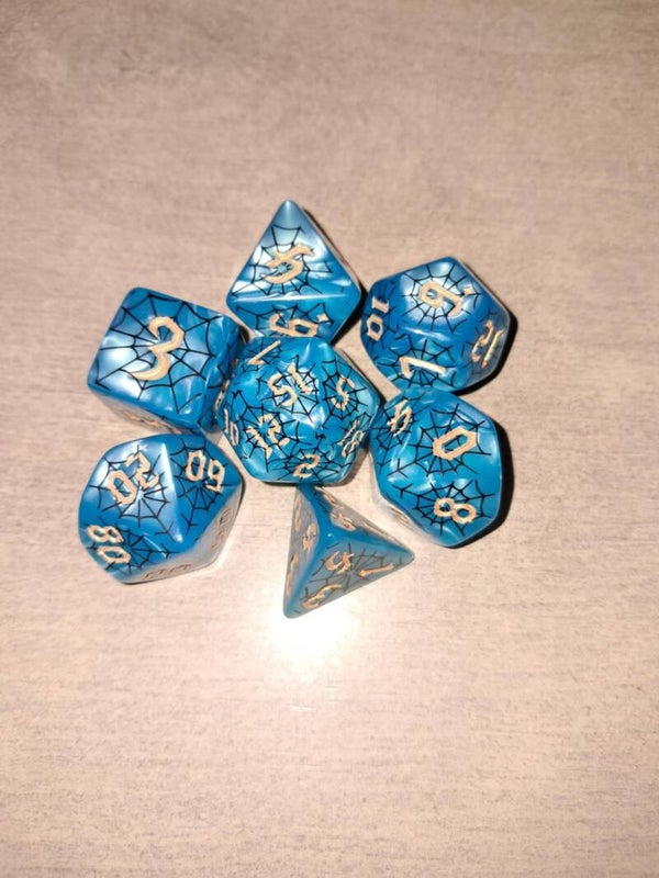 Blue d&d dice with a black web design