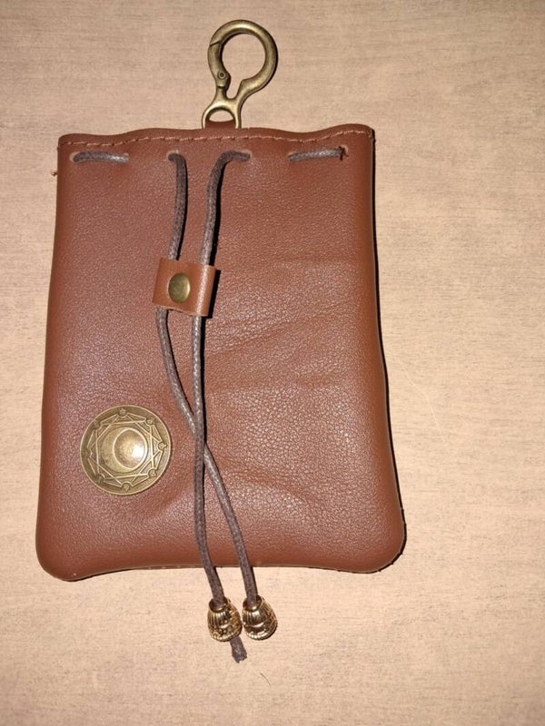 Brown leather dice bag with d&d dragon dice
